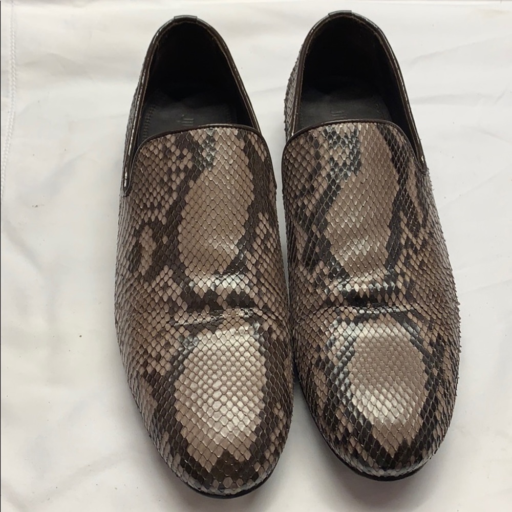 Slightly worn Jimmy Choo loafers.
